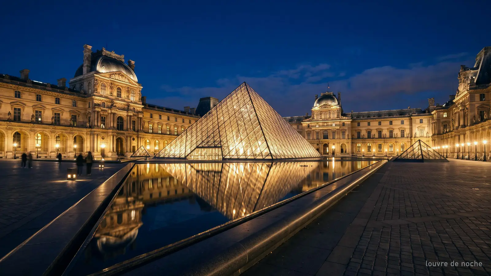 Imagen generada: la pirámide del Louvre iluminada de noche